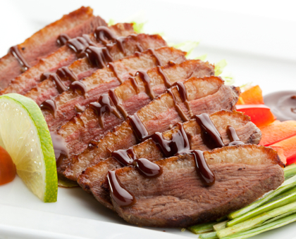 Magret de canard aux groseilles et au miel